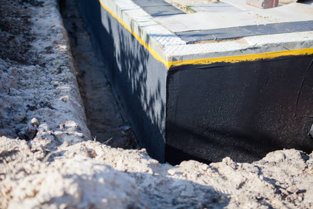 Professional Waterproofing technician working in Grelton, OH